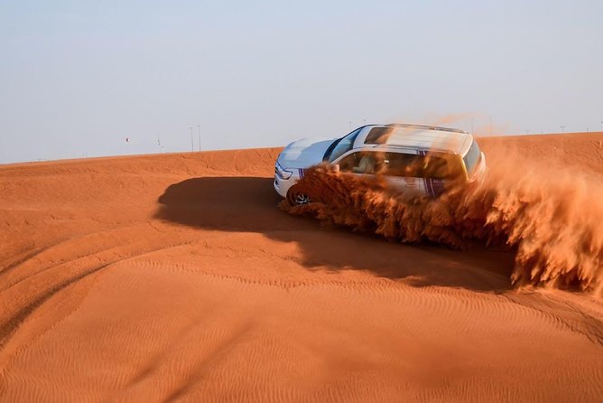 6-Hour Dubai Desert Safari with BBQ Dinner & Quad Biking - Quad biking on the sand