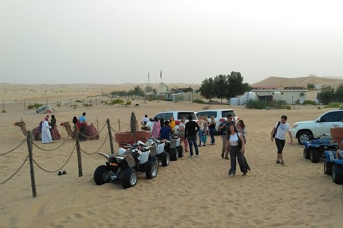 Abu Dhabi: 7-Hours Desert Safari with BBQ, Camel Ride & Sandboarding - Sandboarding and sunset over the dunes