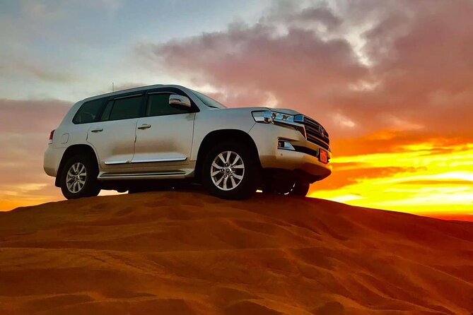 Abu Dhabi Desert Safari BBQ Dinner Live Shows Pick & Drop More - Sunset, sandboarding, and the short camel ride
