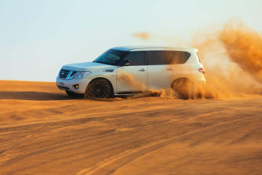 Abu Dhabi: Desert Safari, Quad Bike, Camels & Sandboarding - Sandboarding on the Al Khatim dunes