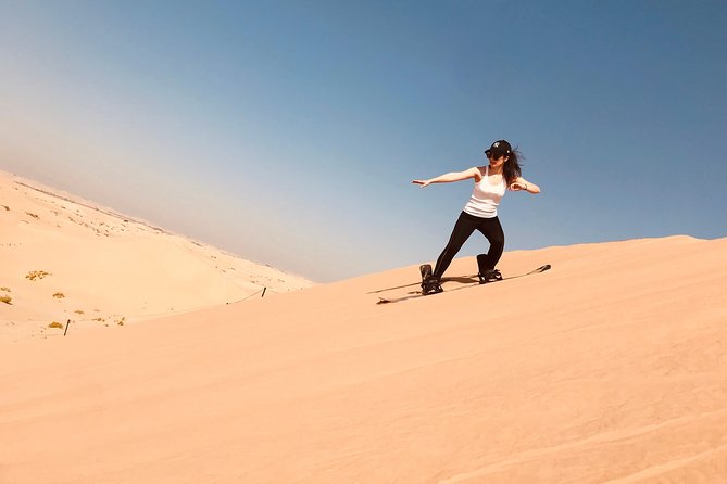 Abu Dhabi Desert safari with BBQ Dinner,Sandboarding & Camel ride - From Abu Dhabi roads to open desert