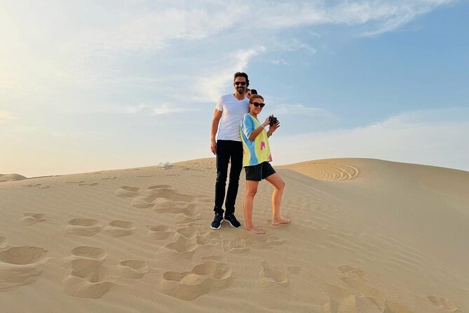 Abu Dhabi Desert Safari With Live Shows And BBQ Buffet Dinner - Camel riding and sand boarding