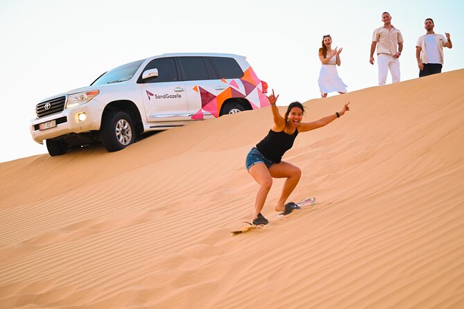 Abu Dhabi Evening Desert Safari - Private car Dune bashing & BBQ - Fire, Tanoura and belly dance performances