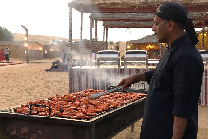 Abu Dhabi Evening Desert Safari with BBQ Dinner and all Camp Activities - Sandboarding, henna, and desert photography