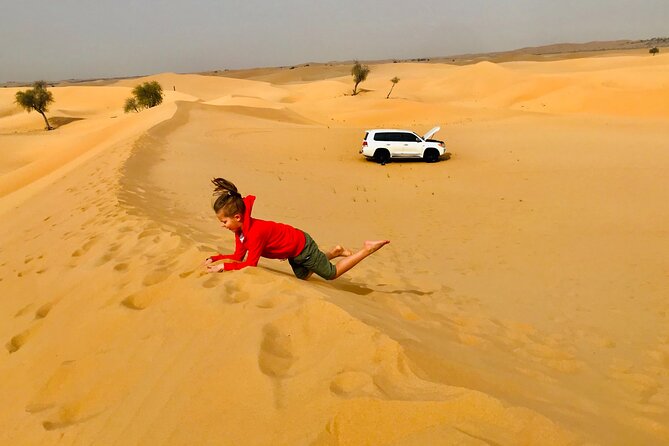 Abu Dhabi Morning Desert Safari,Dune Bashing,Sandboarding,Camel Riding&Quad Bike - Guides, photographs, and the human side of the trip
