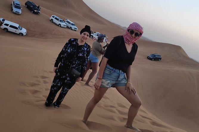 Afternoon Dune Drive Safari with SunSet Photo & Sand Boarding - Al Madam and the red dunes at sunset