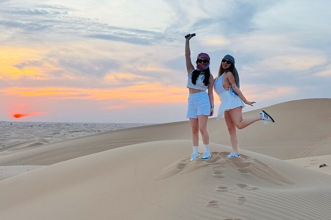 Arabian Desert Safari Abu Dhabi: 6Hour Tour with BBQ & Live Shows - Camel photos, henna, clothing, and camp customs