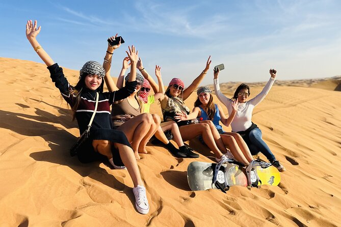 Best Dubai Desert Safari with Buffet Dinner,Sand Boarding & Shows - Red dunes, dune bashing, and sandboarding