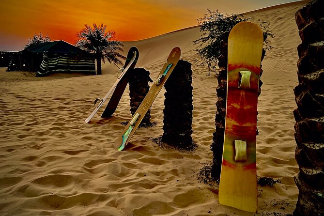 Desert Safari Abu Dhabi w/ Sand Boarding, Camel Ride & BBQ Dinner - Tea, dates, henna, and the Bedouin-style camp