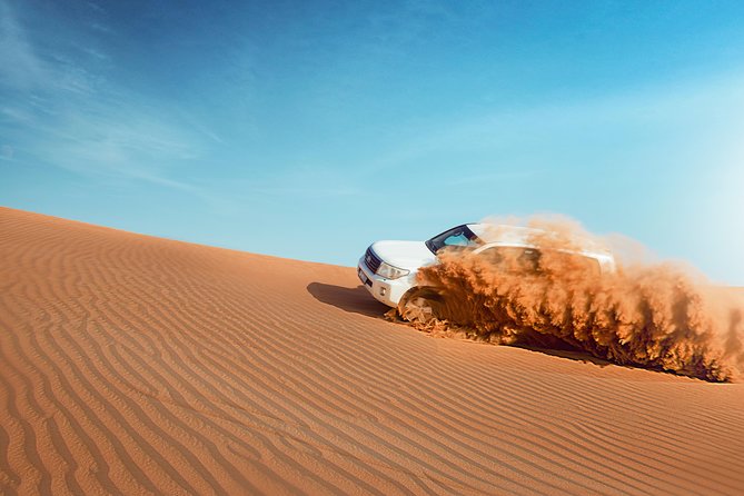 Desert Safari Dubai with Dune Bashing, Sandboarding, Camel Ride, 5 Shows, Dinner - From Dubai hotel to Al Awir’s open sand