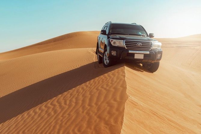 Desert Safari Dubai with Dune Bashing, Sandboarding, Camel Ride, 5 Shows, Dinner - Dinner under the camp lights