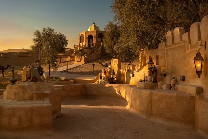 Desert Safari: Luxury Fortress Dinner, Camel Ride & Dune Bashing - Entering the illuminated desert fortress
