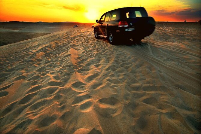 Desert Safari – Morning, Afternoon, Sunrise & Sunset Options - Preparing the 4x4 at the camel camp