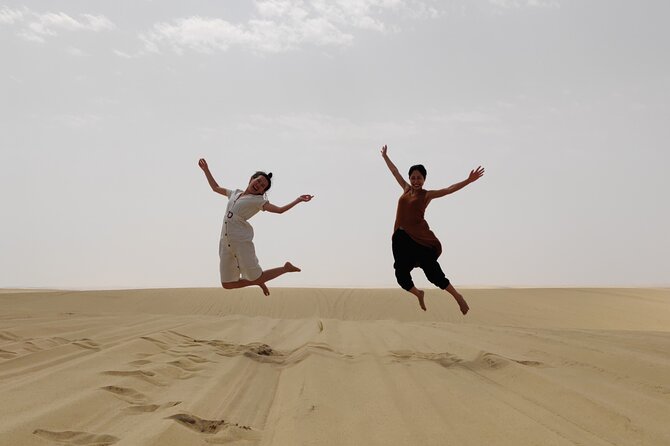 Desert Safari, Quad Bike, Sandboarding and Camel Ride - Camel riding at Sealine Beach