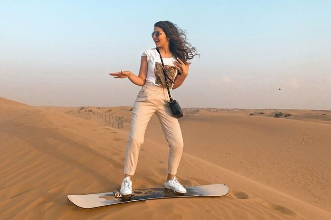 Doha Desert Safari Camel Ride, Sandboarding and Inland Sea - Sandboarding on Qatar’s golden dunes