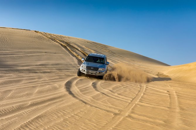 Doha Desert Safari: Dunebashing, Camel, Sandboarding & Inland Sea - Sandboarding and the walk back up