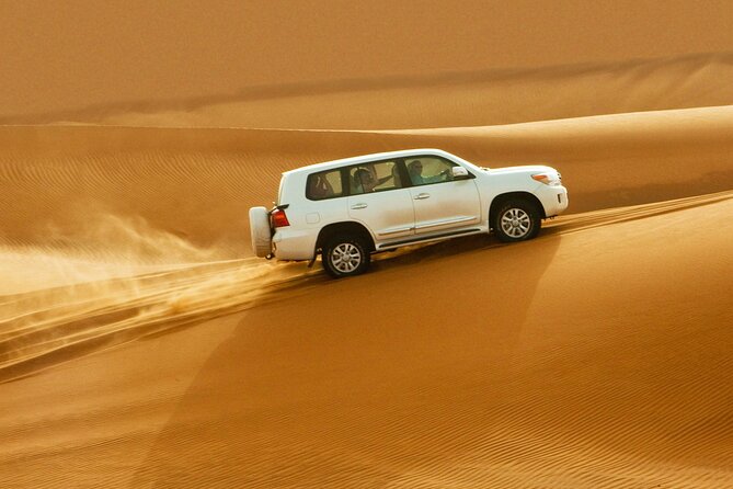 Doha: Desert Safari, Sand Boarding, Camel Ride & Inland Sea - Dune bashing across Qatar’s golden sand