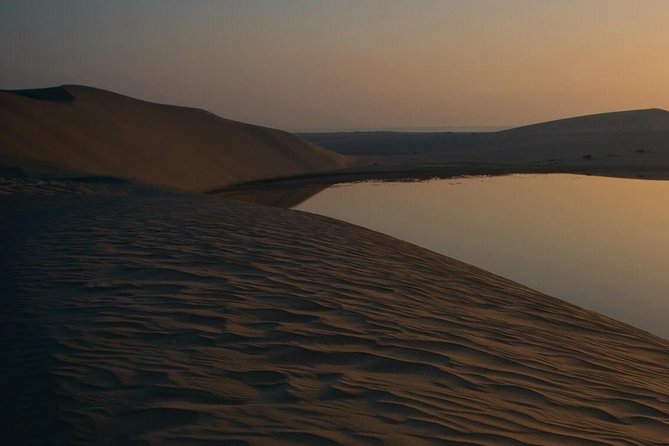 Doha: Desert Safari With Quad bike ,Camel Ride And Sand Boarding - Khor Al Adaid, where the sea reaches the dunes