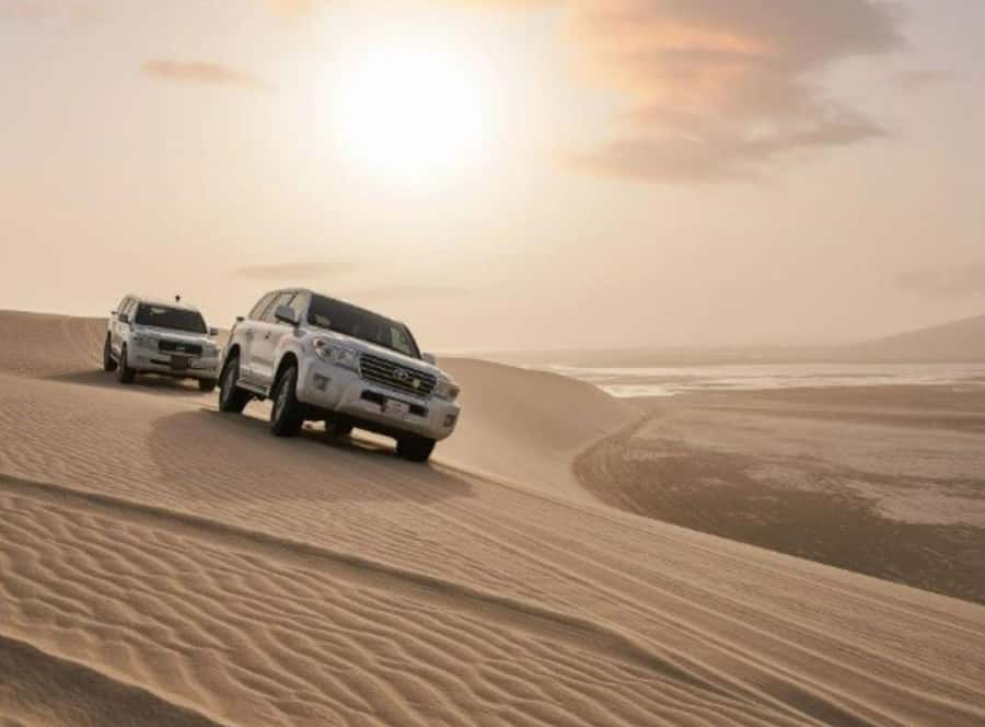 Doha : Inland Sea Desert Safari ,Camel Ride & Sandboarding - Dune bashing across Qatar’s sandy ridges