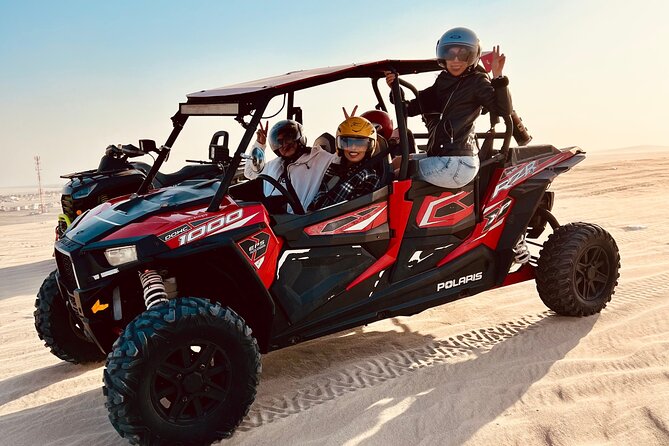 Doha: Luxury Desert Safari, Quad Bike & Sandboarding - Sandboarding from a high dune