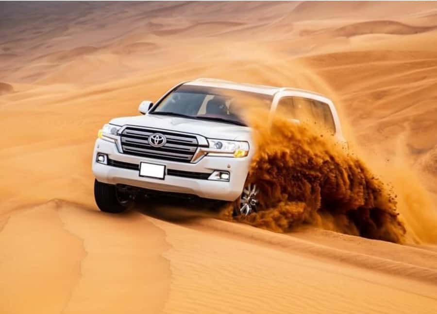 Doha: Relax Desert Safari, Camel Ride, Inland Sea, Swimming - Dune driving with a guide who sets the pace