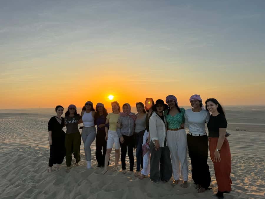 Doha: Sunset Safari, Dune Bashing, Sandboarding & Camel Ride - Sandboarding on Qatar’s open dunes