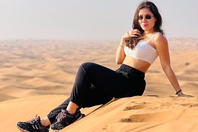 Dubai Desert Safari, BBQ, Live Shows, Camel, Sandboard (7-Hours) - Sandboarding and the simple pleasure of a camel ride