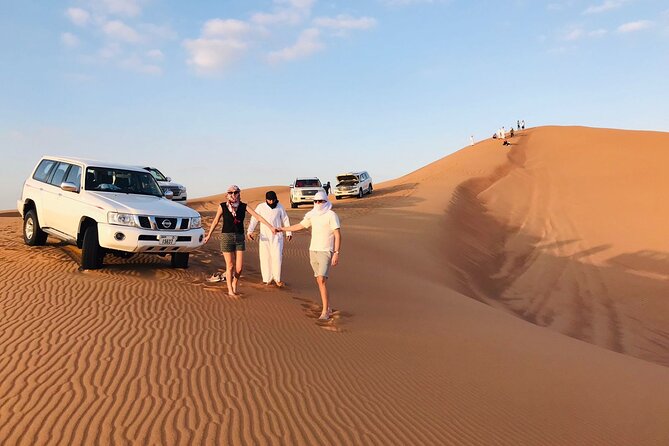 Dubai Desert Safari, Camel, Live BBQ & Shows (Private 4x4 Car) - Sandboarding and photographs break up the drive