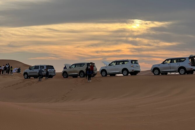 Dubai Desert Safari, Camel Ride, Shisha, Henna, Live BBQ & Shows - Sandboarding, photographs, and a desert pause