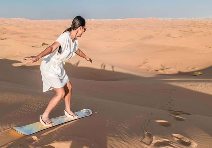 Dubai: Desert Safari Camel Riding, Sandboarding & BBQ Dinner - Dune bashing across the red sand