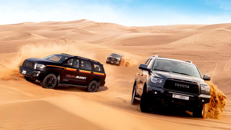 Dubai Desert Safari - Premium BBQ Dinner, Camel Ride & Shows - Sandboarding and the highest-dune photo stop