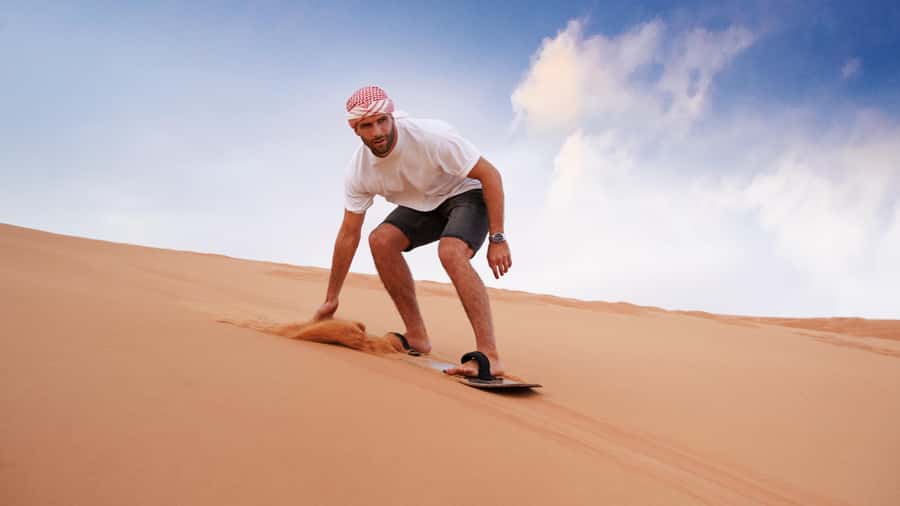 Dubai Desert Safari - Premium BBQ Dinner, Camel Ride & Shows - Sunset at a Bedouin-style camp