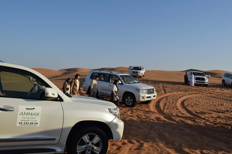 Dubai: Desert Safari, Quad Bike, Camel Ride and Sandboarding - Sunset turns a busy outing into a memorable one