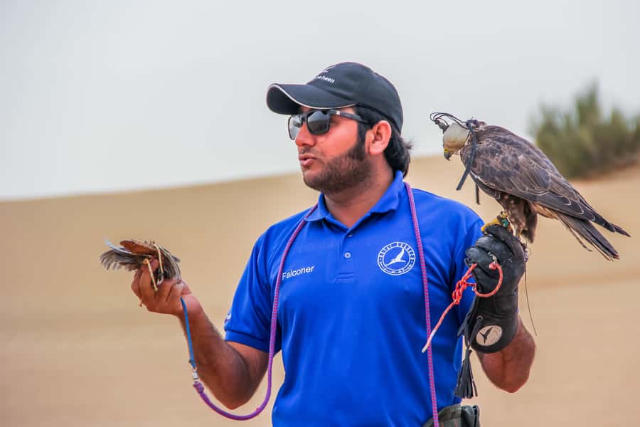 Dubai Desert Safari, Quad Biking, Camel Ride, & Sandboarding - Arabic coffee, dates, and camp traditions