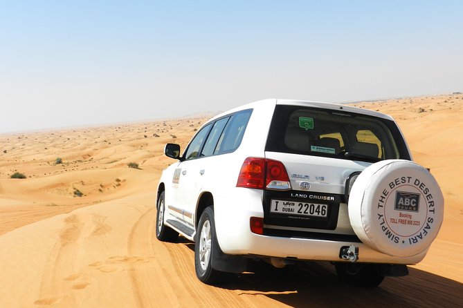 Dubai Desert Safari with BBQ, 3 Shows & Camel Ride at Majlis Camp - Dune bashing, sandboarding, and the soft-track choice