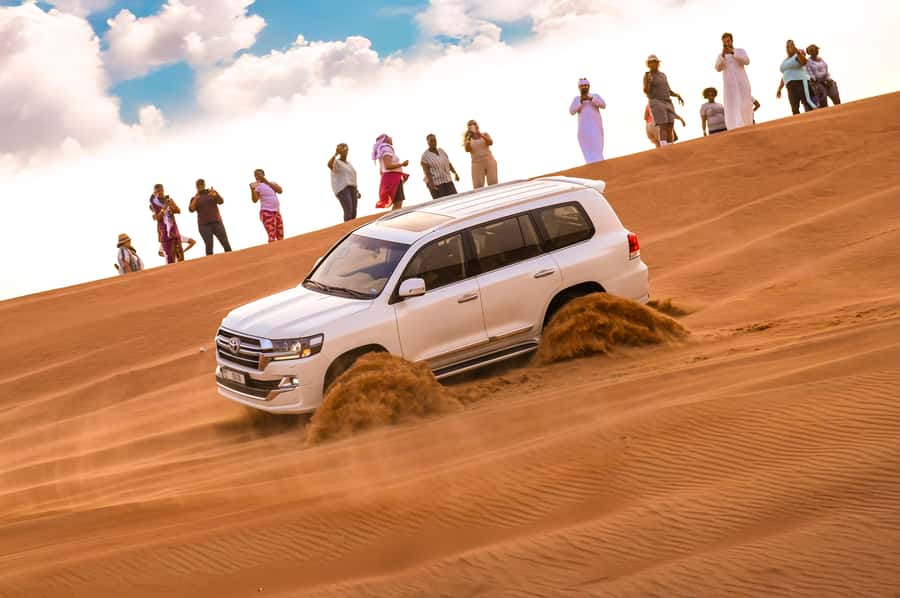 Dubai: Desert Safari with BBQ Dinner & Quad Biking Options - Pickup, timing, and the ride to Lahbab