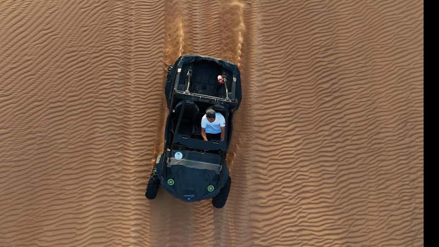 Dubai: Dune Buggy Safari and Camel Ride with Transportation - Red dunes, rock formations, and photo stops