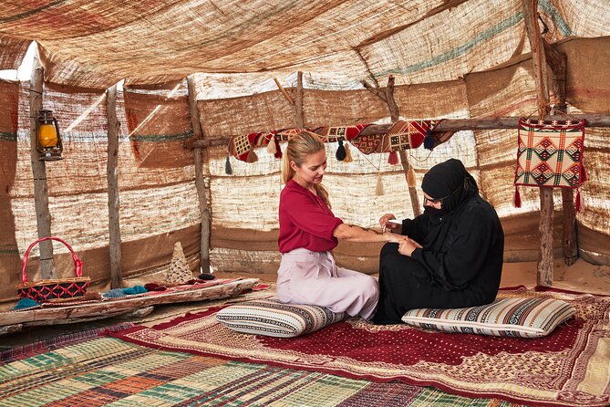 Dubai Evening Heritage Safari by Vintage G Class Al Marmoom Oasis - Coffee, bread, and local clothing add useful detail