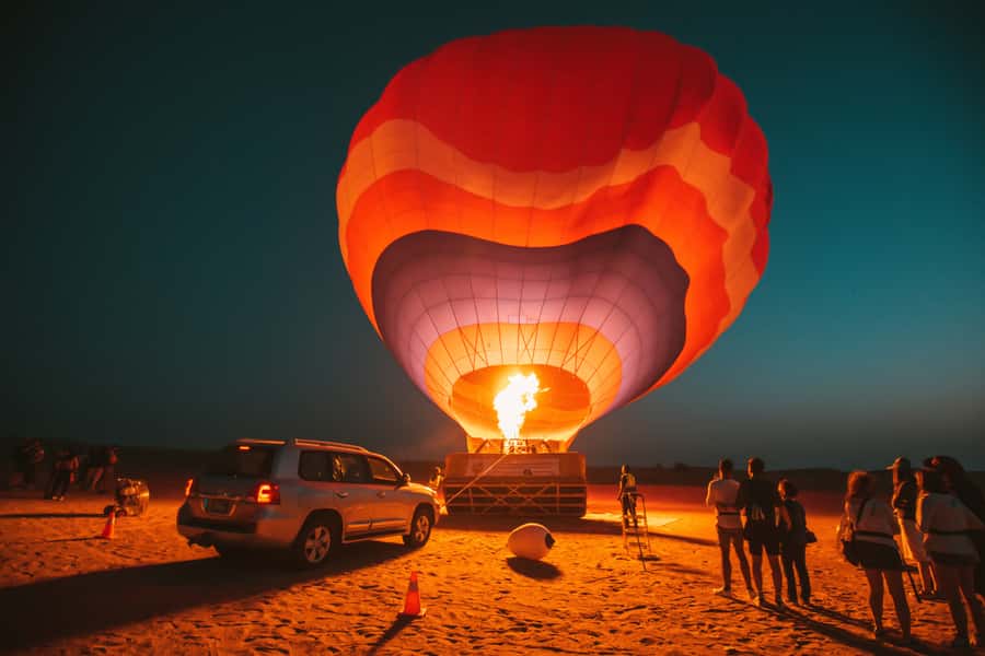 Dubai: Hot Air Balloon, Desert Safari, and Quad Biking Tour - Sunrise over Dubai’s red dunes