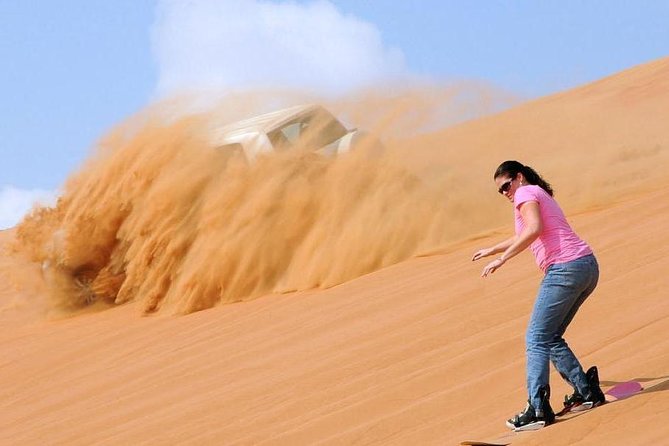 Dubai Morning Desert Safari: Camel Ride & Sandboarding! - From Dubai hotels to the red dunes of Lahbab