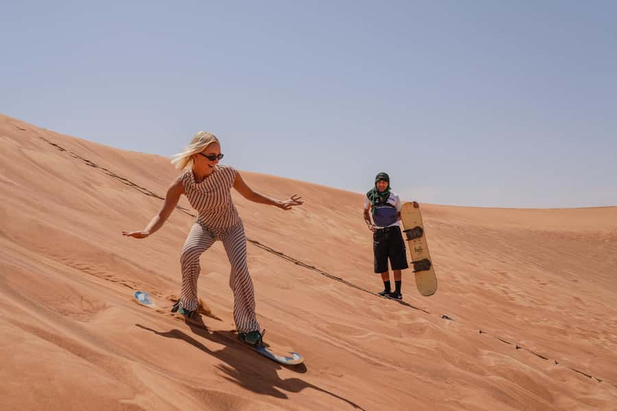 Dubai: Overnight Safari with Luxury Dome Stay & Stargazing - Camel walking at sunset