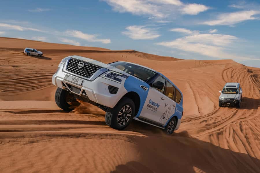 Dubai: Premium Safari, Camel Ride & Al Khayma Camp 3-Buffets - The pickup and drive to Dubai’s red dunes