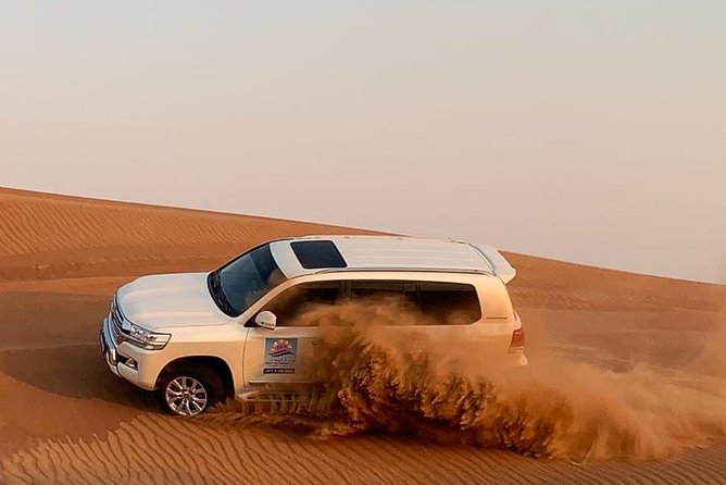 Dubai Private Morning Desert Safari: Camel Ride & Sandboarding - Dune bashing across Lahbab