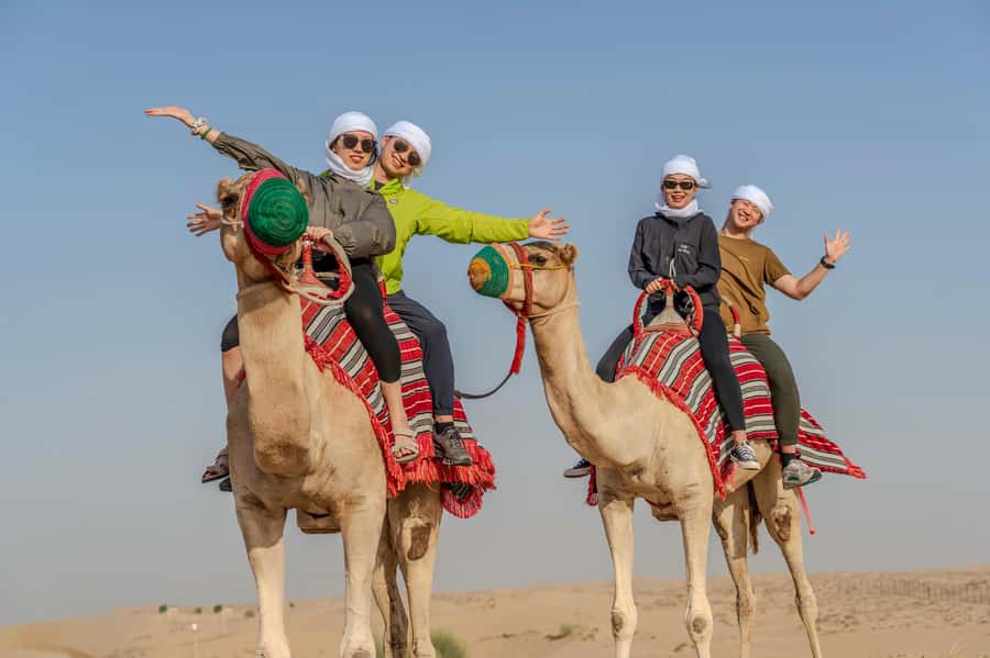 Dubai: Quad Bike Safari, Camels & Al Khayma Camp BBQ Dinner - Camel riding, feeding, and the move to Al Khayma