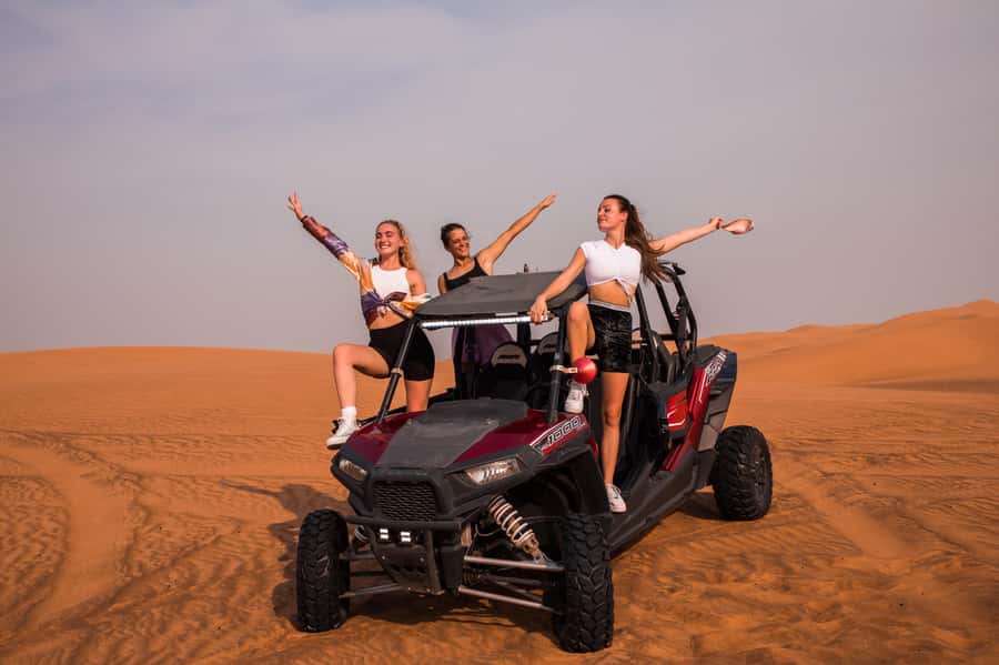 Dubai: Red Dune Desert Safari, Quad Bike, Camels, and BBQ - Sandboarding on steep desert slopes