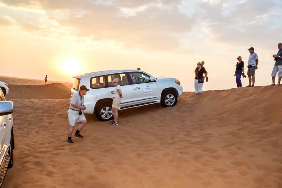 Dubai: Red Dune Safari, Quad Bike, Camel Ride, BBQ Dinner - Sandboarding and sunset photographs