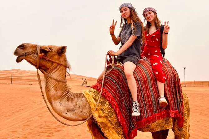 Dubai Red Dune Safari with Bedouin BBQ Dinner & Hotel Transfers - Al Awir camp: camel ride, falconry, and henna