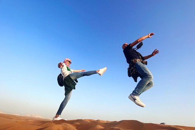 Dubai Red Dunes Safari, ATV, Camel ride, BBQ at Desert Camp - Your first turn on the ATV