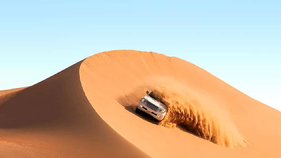 Dubai: Safari, Quad Bike, Camel Ride, and Buffet Dinner - From Dubai towers to Lahbab’s red dunes