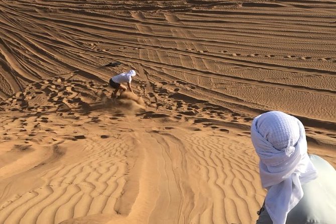 Dubai: Unique SUNSET Quad Bike Red Dunes Safari - Sandboarding with the sun dropping